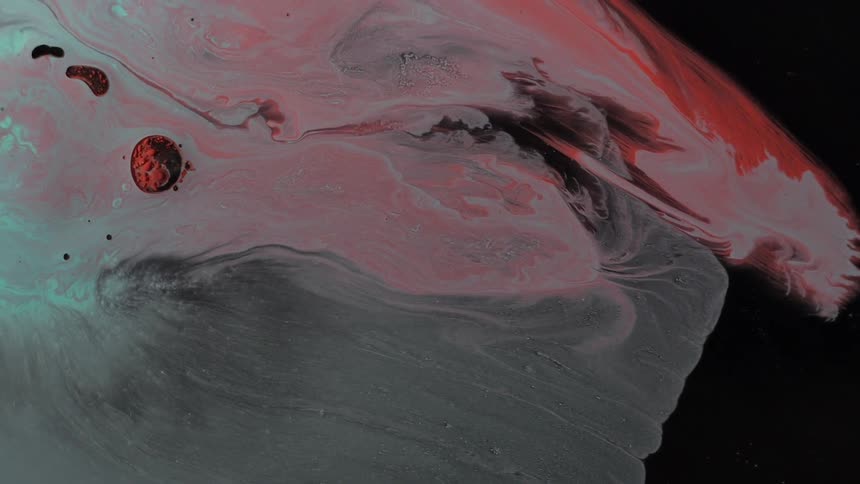 Colored liquid swirls and moves across the screen