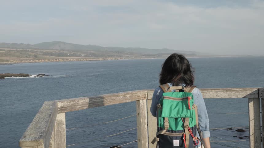 A child is walking to look at the water