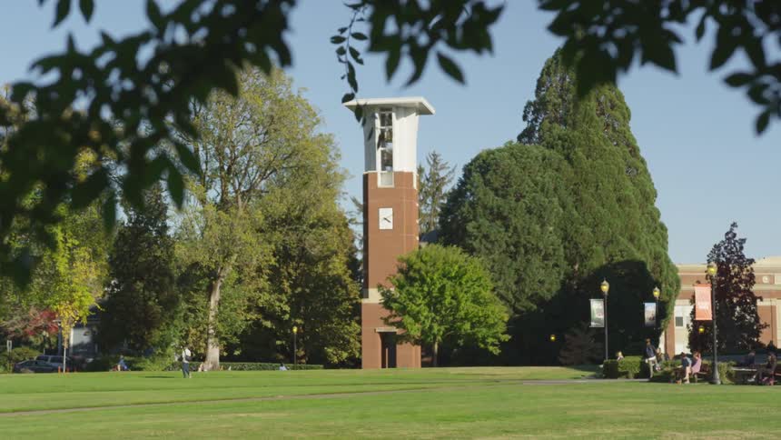 Students stroll across a college campus