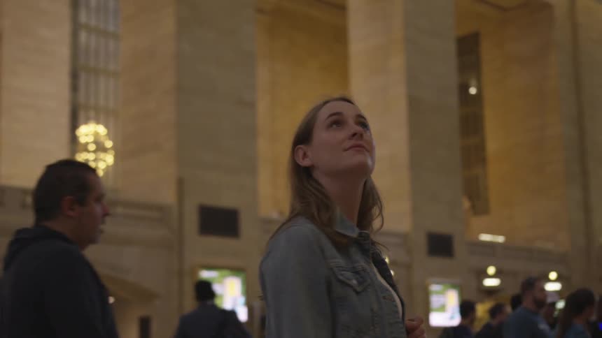 A woman looks around the building