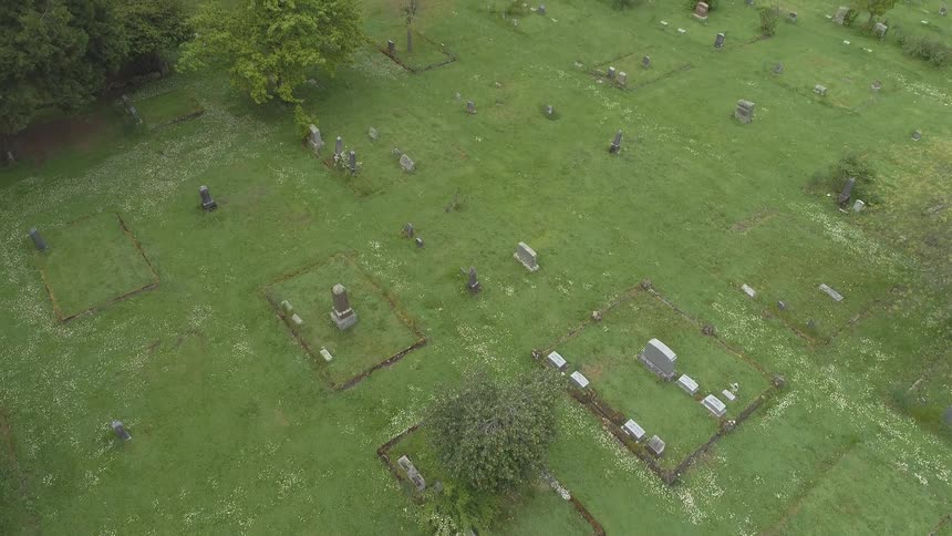 View of rural cemetery with tombs on a cloudy day