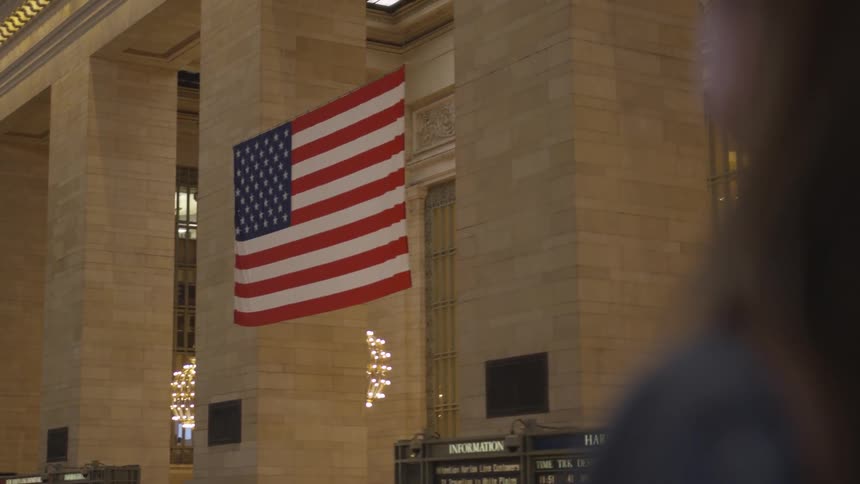 An american flag hanging in a building