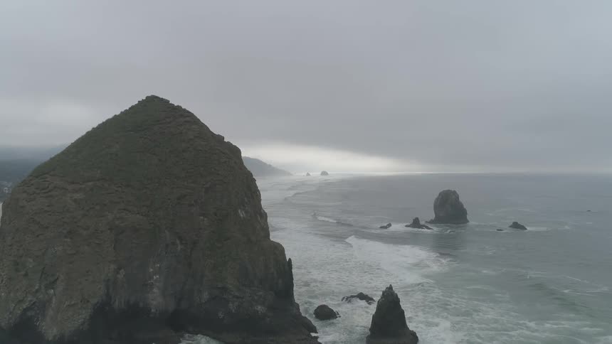 Landscape view of waves crashing into rocks