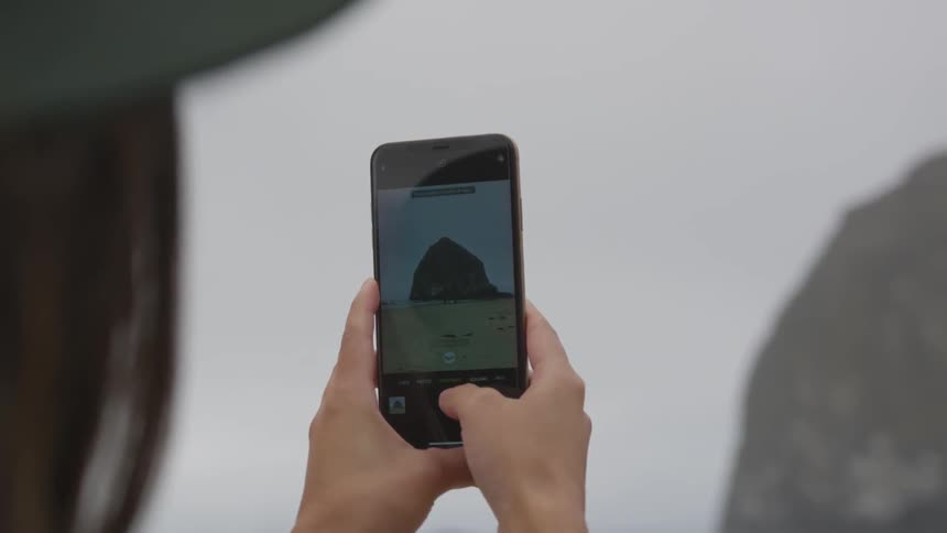 A person is taking photos with a phone