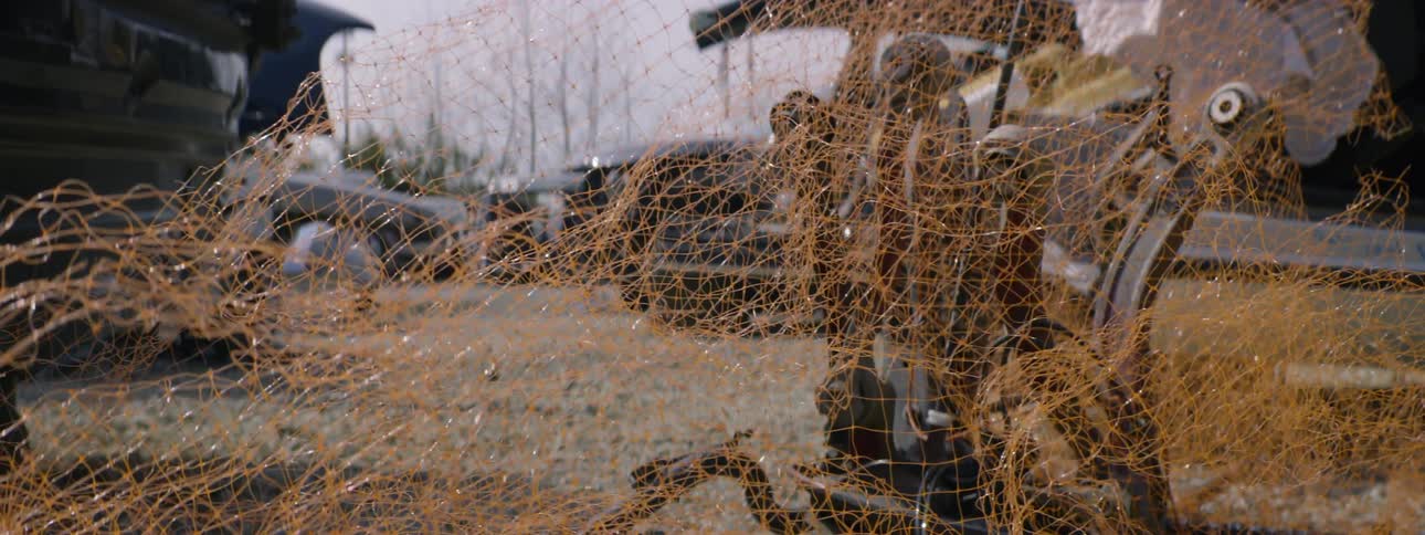 Plastic netting in a junkyard during the day