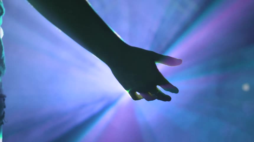 Man holding hand in front of light