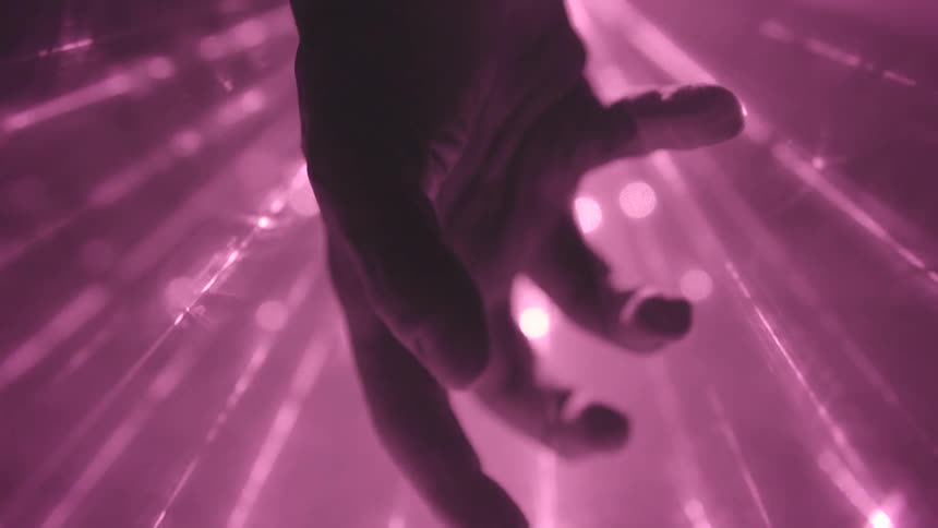 This is a hand it makes a fist and slowly opens while the lights and lasers flash and streak behind it