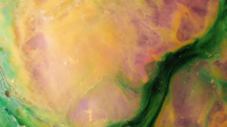 A colorful pallet has green yellow and purple on it