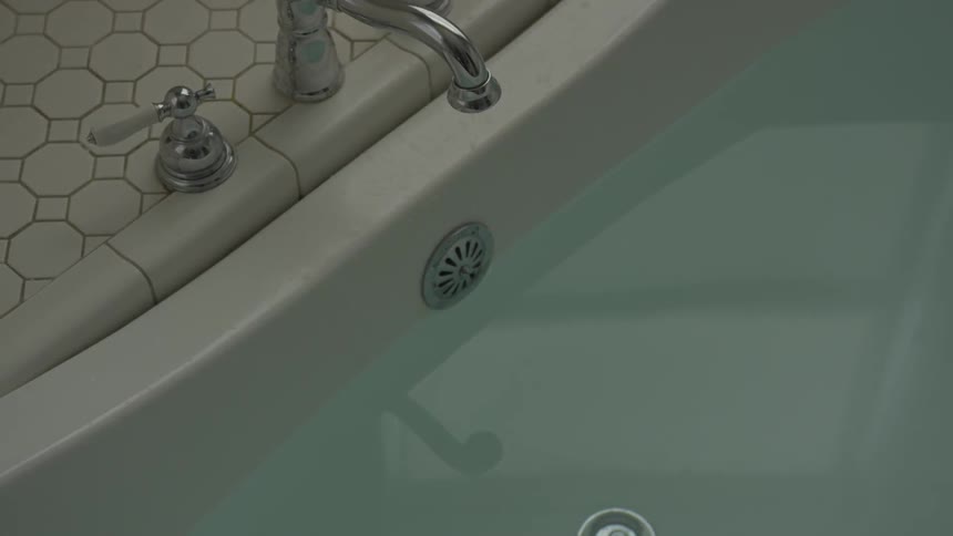A bathtub that is full of water