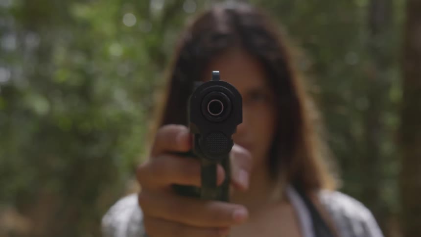 Girl holding a gun