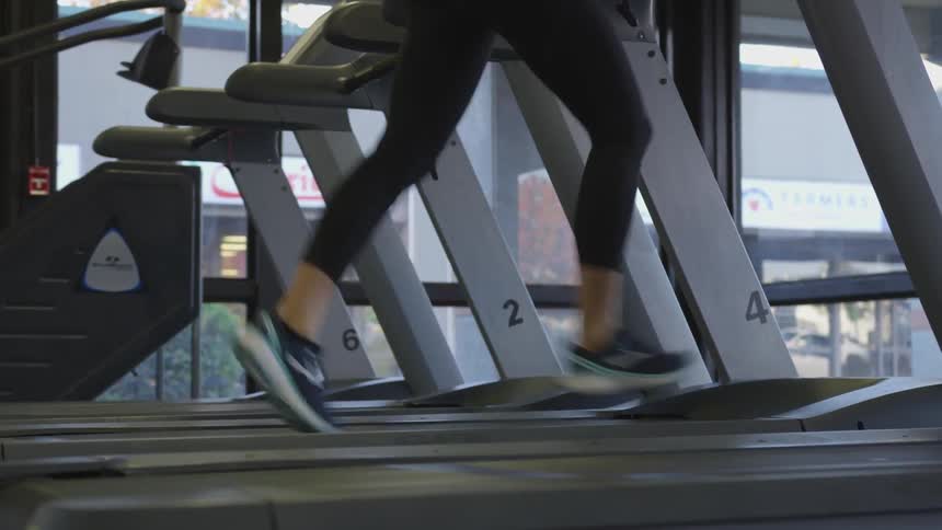 A woman running on a treadmill