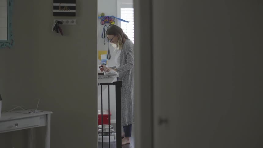 A woman tending to an art project