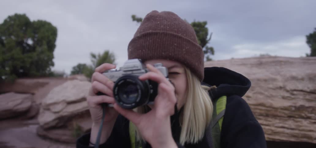 A woman getting ready to take a photo