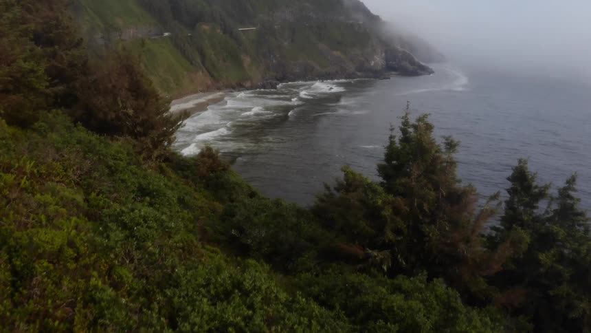 Aerial view of the mountainside by the ocean coast