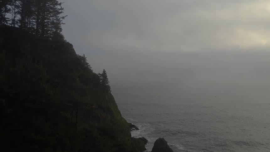 Aerial view of sea cliffs on a foggy day
