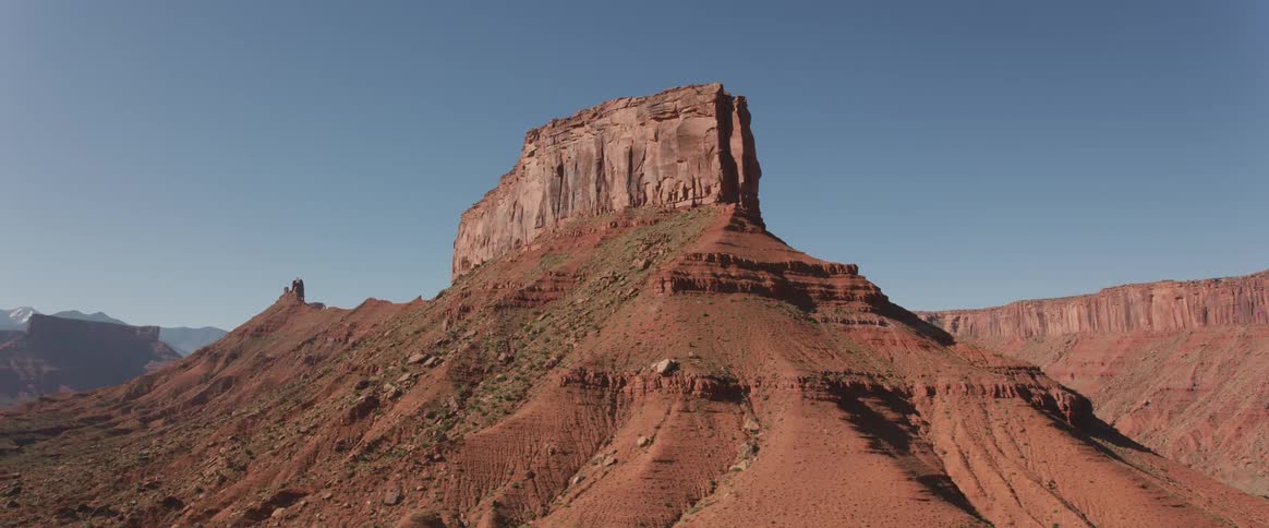 A mesa in a desert during the day