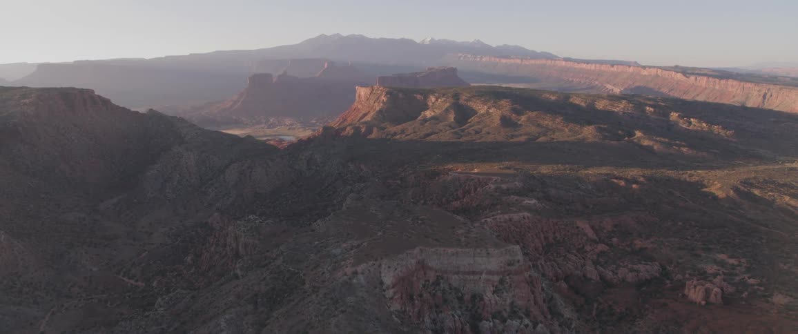 The camera flies over desert mesas and canyons