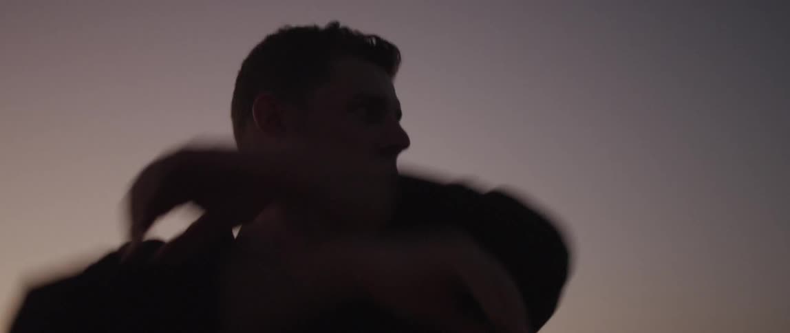 A man stretches his arms from side to side