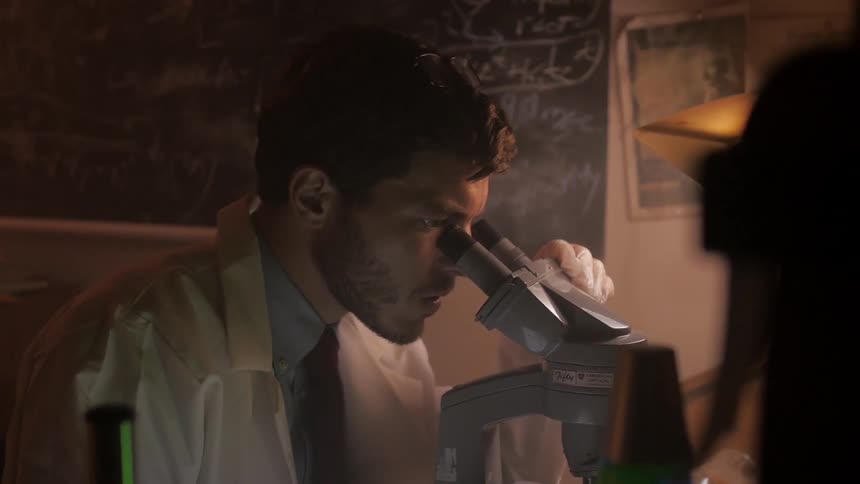 A man using a microscope