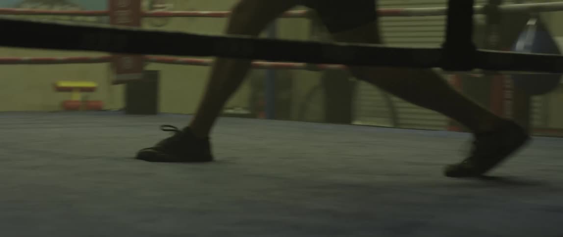 A man is boxing indoors