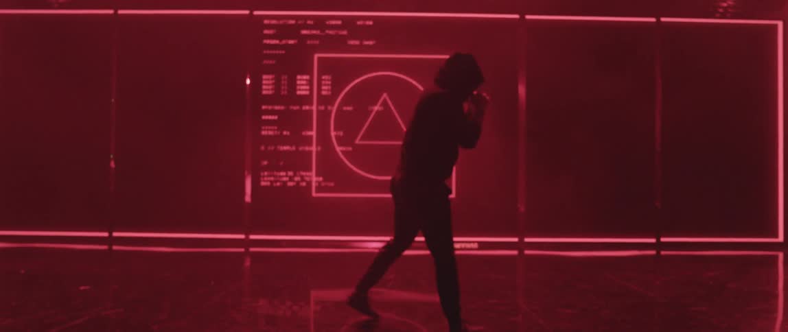 A person punching in front of a screen