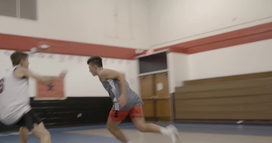 People play basketball in the basketball court