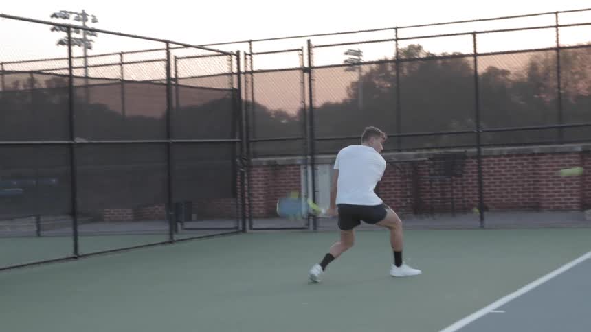 A man swinging at a tennis ball