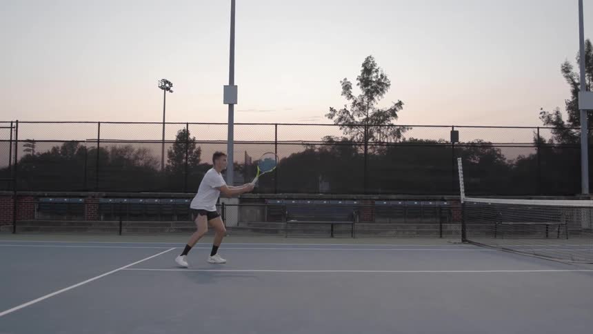 Man playing tennis on a tennis court