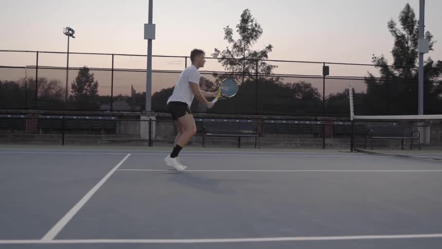 Man returns tennis serve