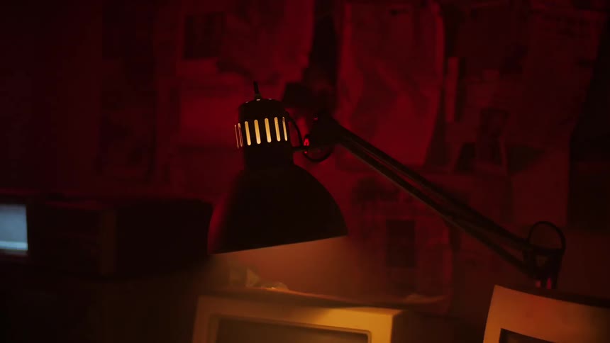 A desk lamp flashes on and off