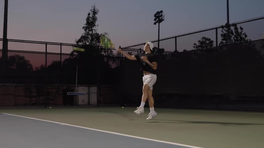A man hitting a tennis ball