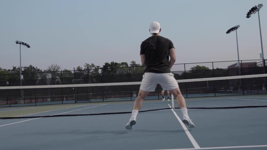Two men play a game of tennis
