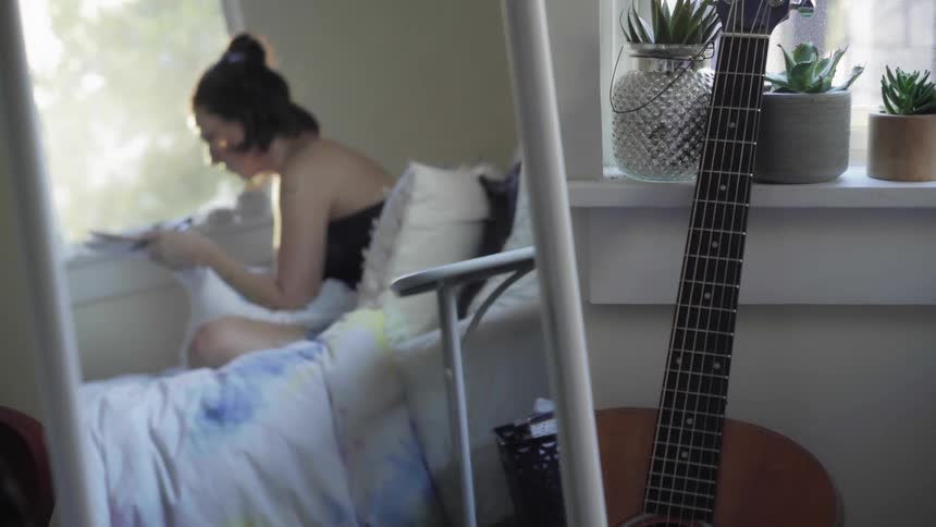 A woman writing on a piece of paper