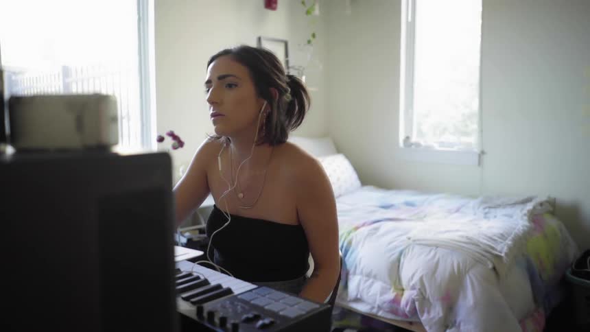 A woman working at a piano