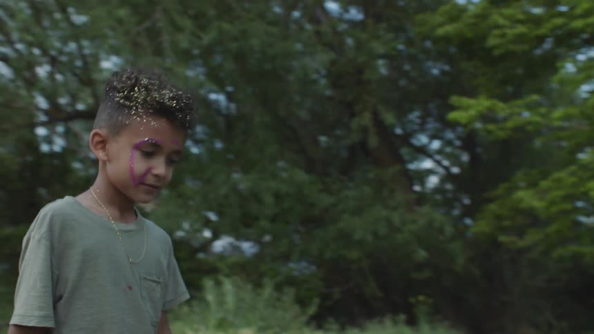 Three kids playing outdoors in a field