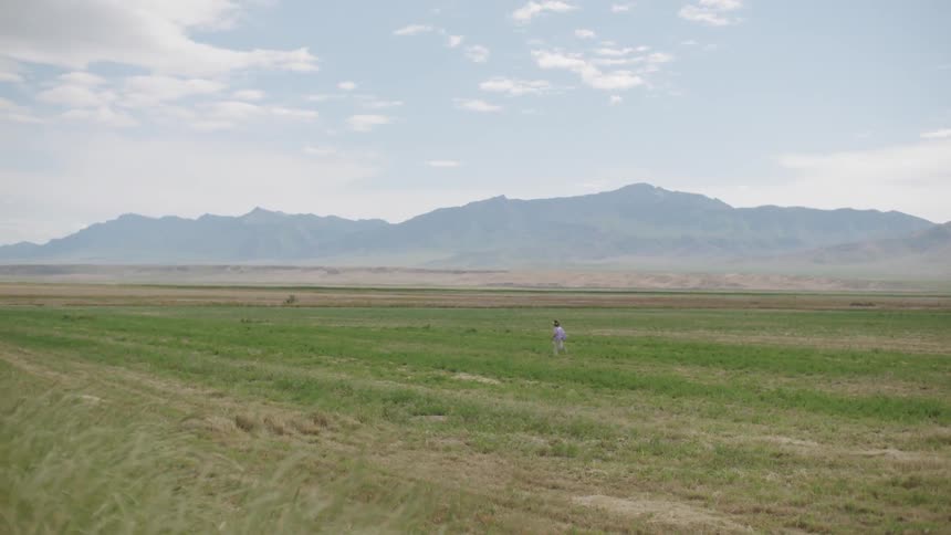 A person running through an open field