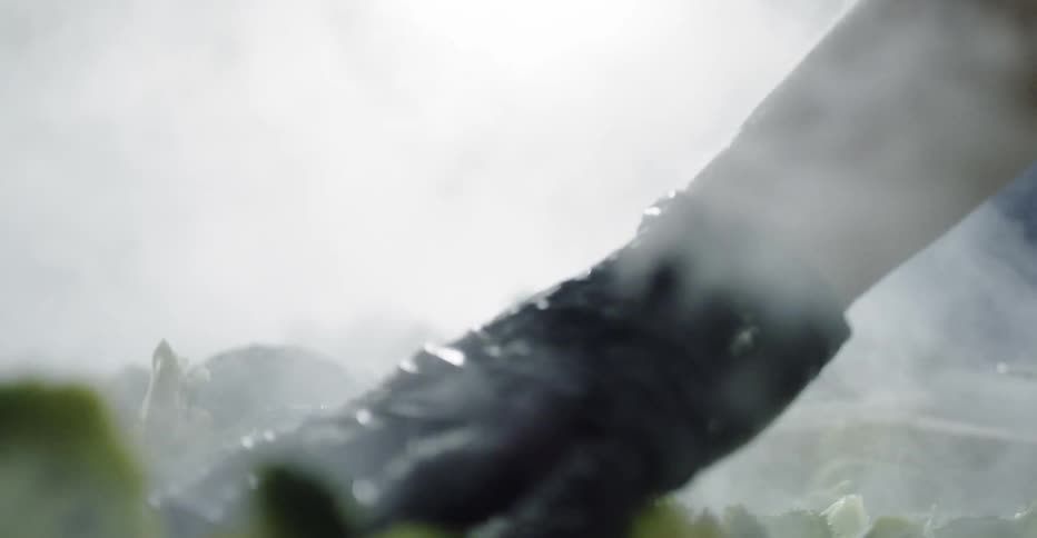Broccoli being steamed over hot water