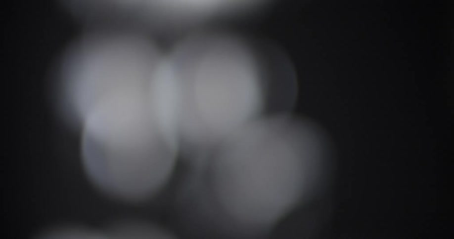 Abstract of white bokeh on a black background