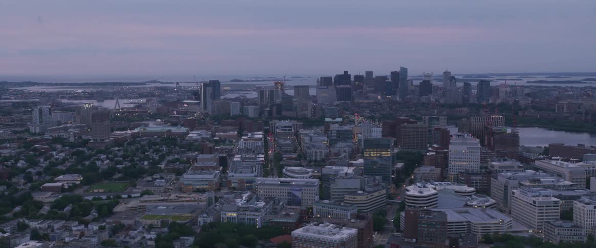 Flying over a city with a river in the middle of it