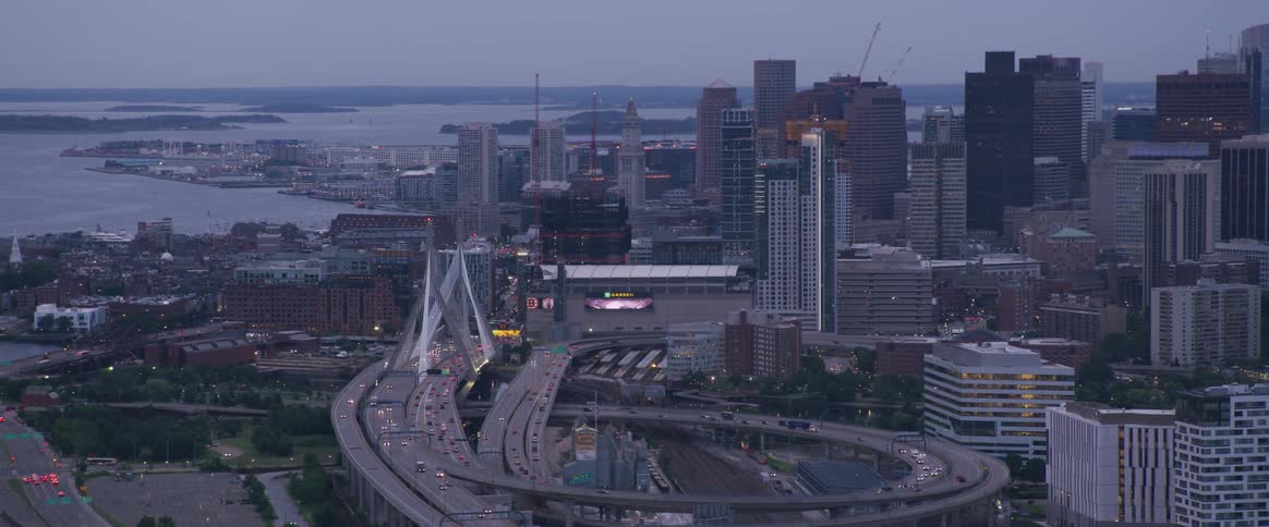 The city by the shore is lighting up at dawn