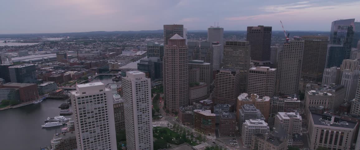 The camera files over a large metro city