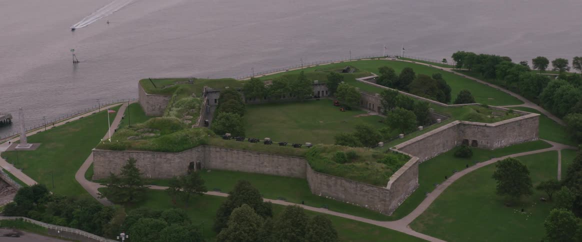 A boat approaches fort independence on castle island in boston