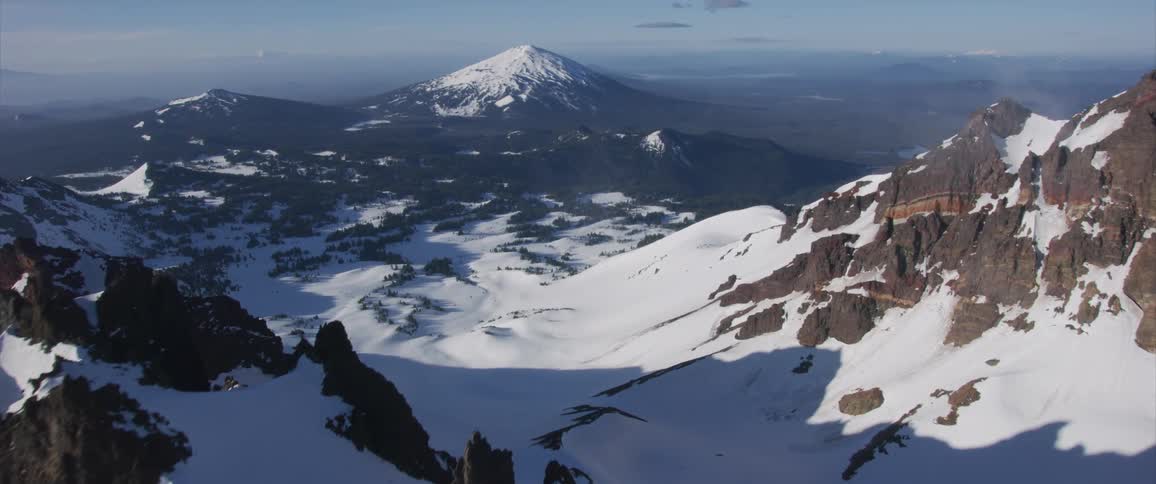 Snow covers a mountain in the wilderness