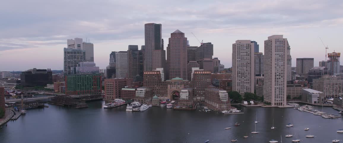 Boats are docked all around the coast of the city