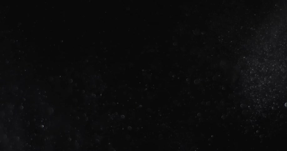 Dark area with small debris floating around