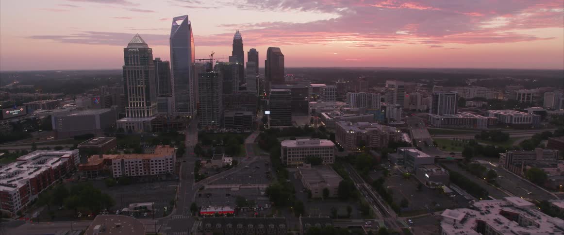 Aerial photography over a city skyline during sunset