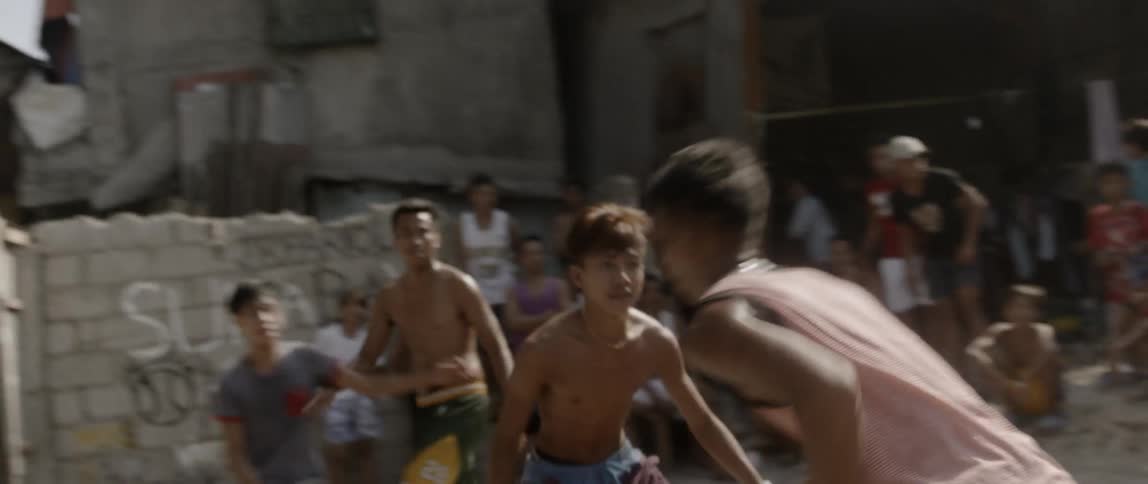 A group of kids playing basketball together