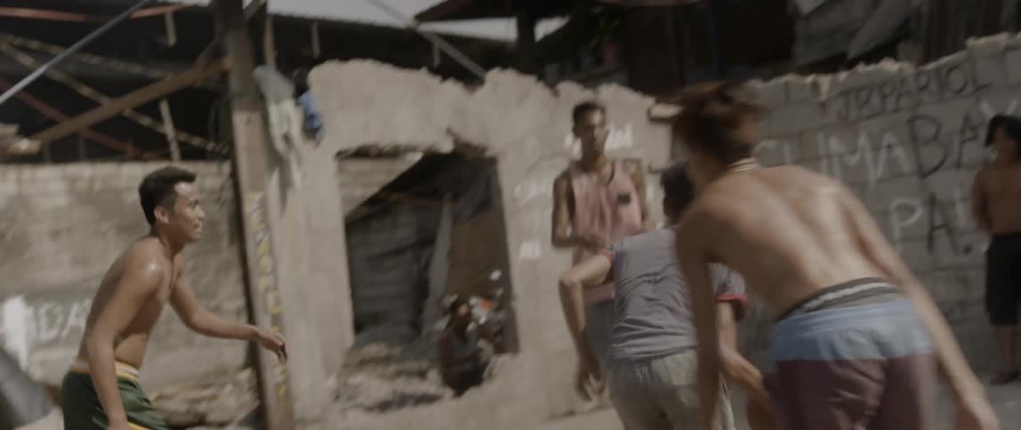 A group of boys playing basketball