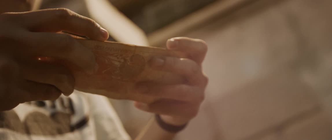A woman fold a piece of paper up