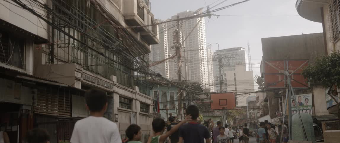 Crowded street between apartment buildings near downtown